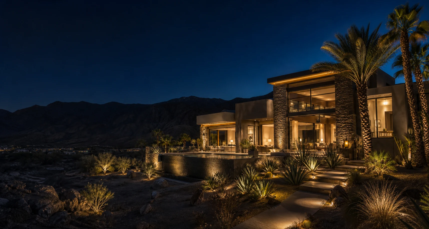 A contemporary Palm Desert estate with layered architectural and landscape lighting at night