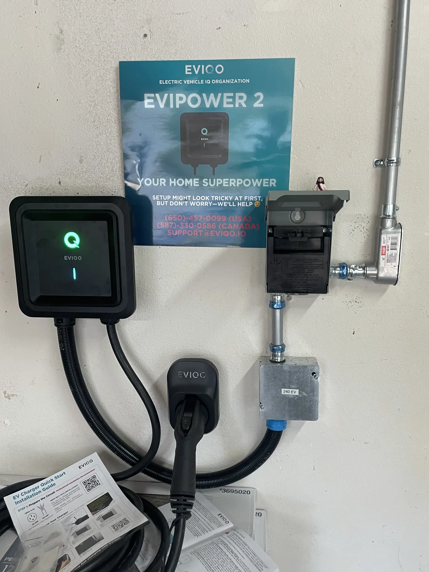 Hardwired Level 2 charger with conduit, disconnect, and a labeled 240-volt junction box