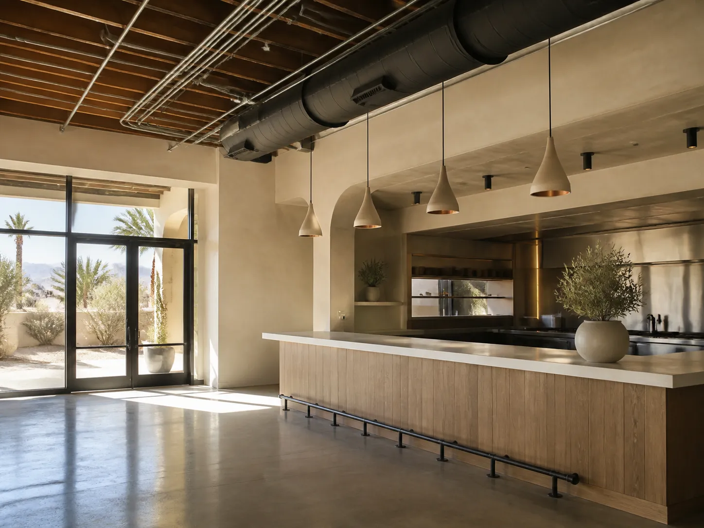 Upscale desert commercial interior with orderly conduit and pendant lighting
